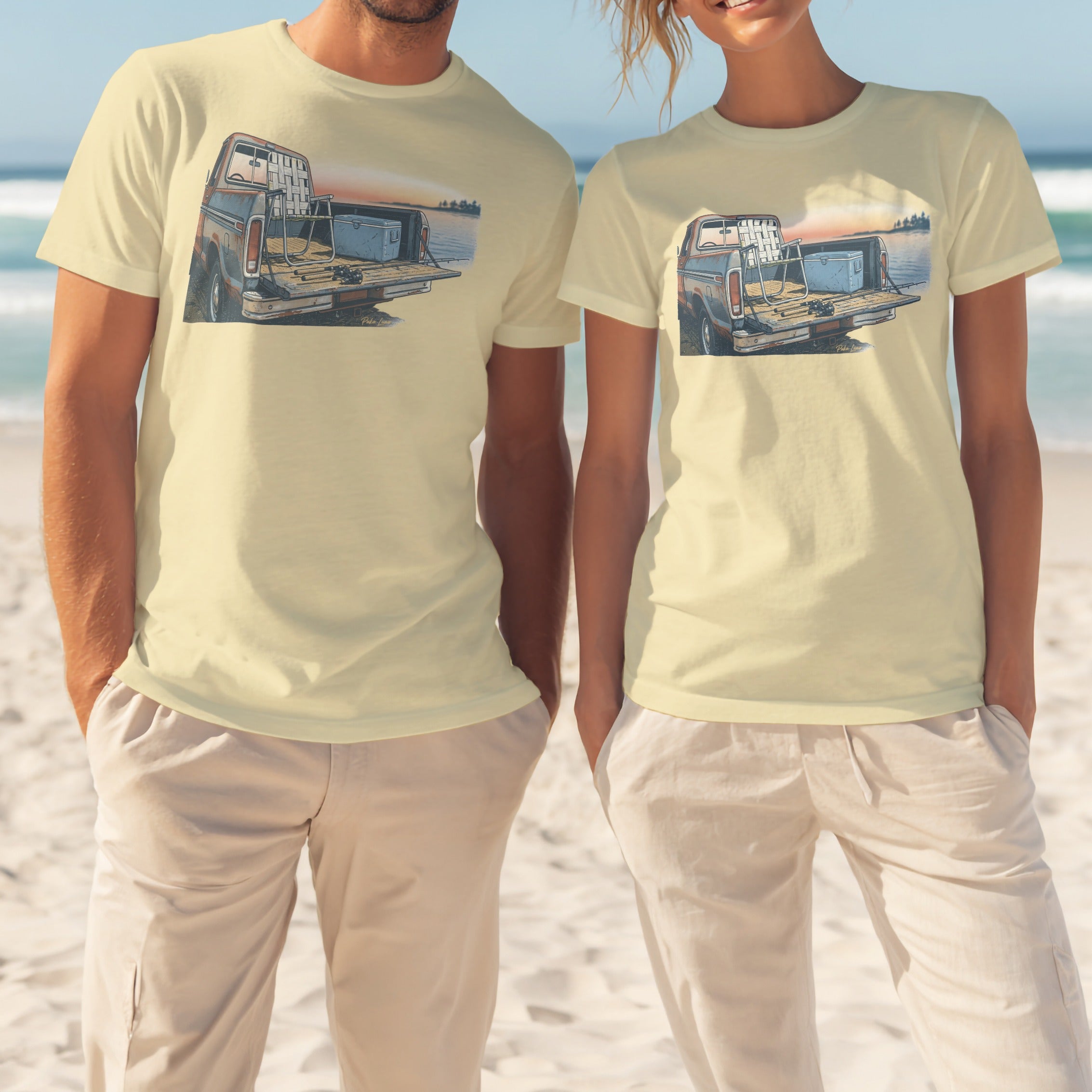Couple wearing cream t-shirts with a vintage truck and fishing gear graphic.