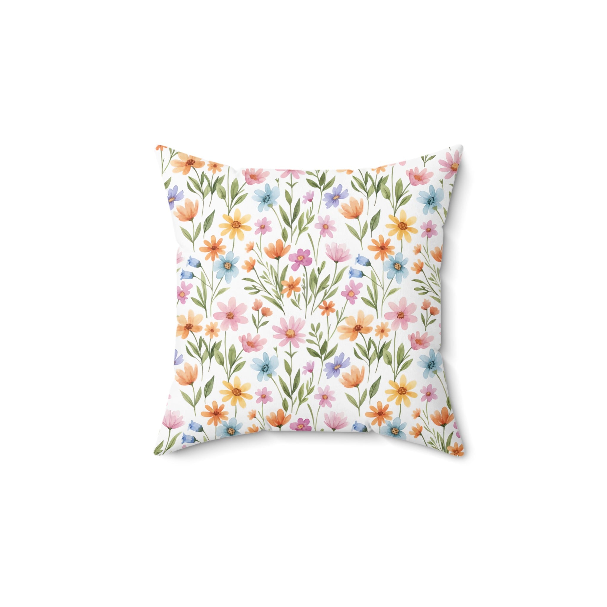 Square pillow with a watercolor floral pattern of small, colorful flowers.