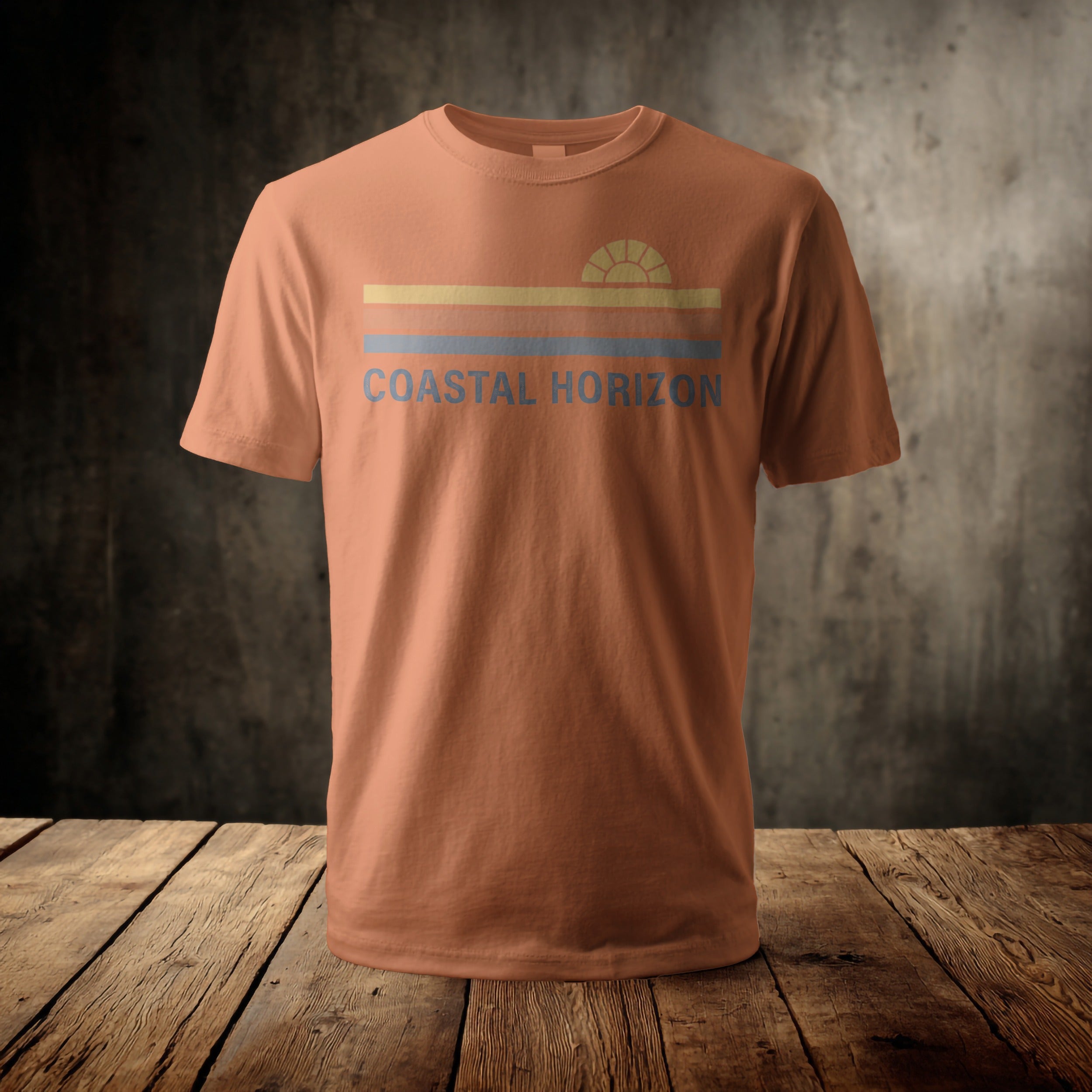 Orange t-shirt with "Coastal Horizon" text and a striped sunset graphic.