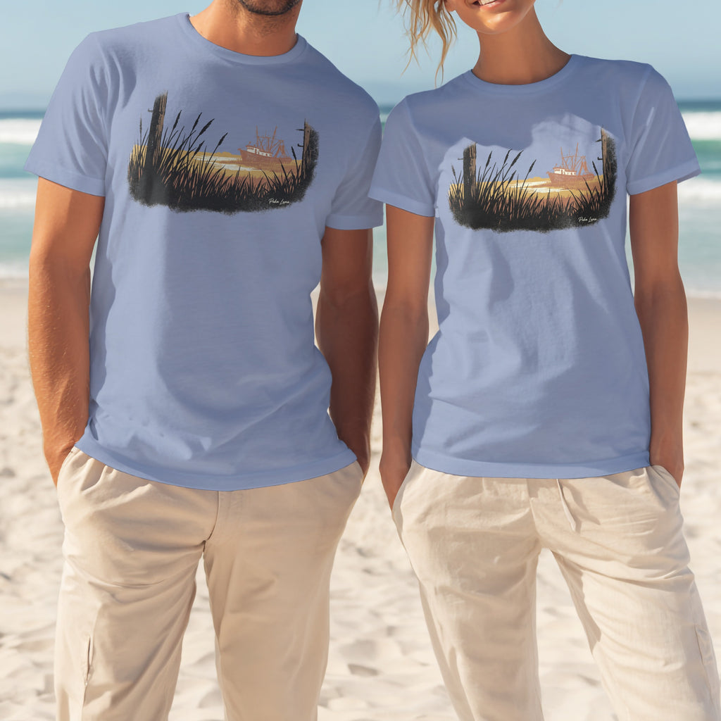 Two people in blue t-shirts showing a sunset over water with reeds.