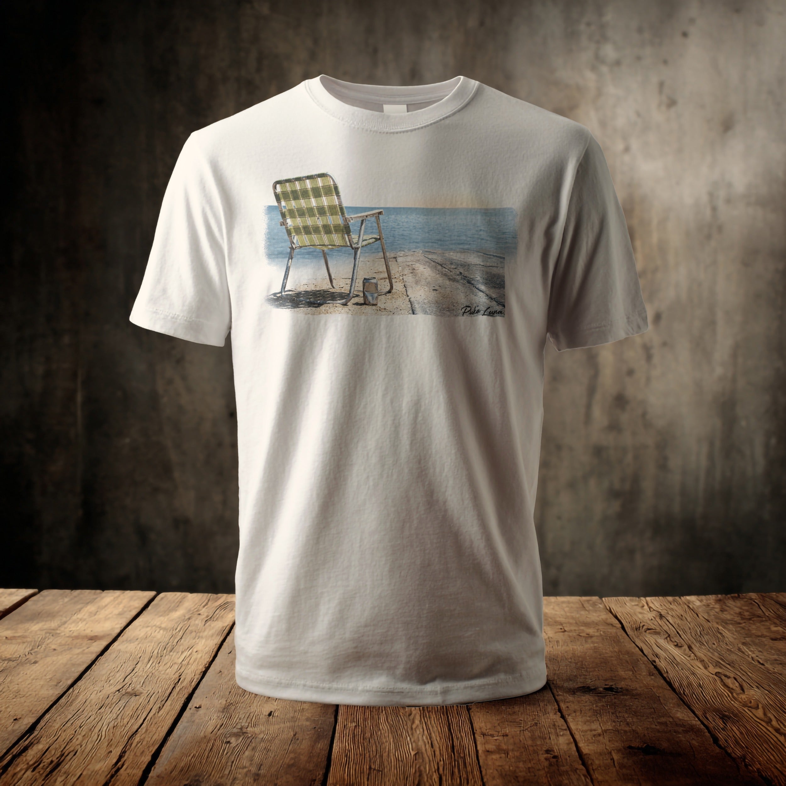 White t-shirt displaying a painting of a chair on a pier.