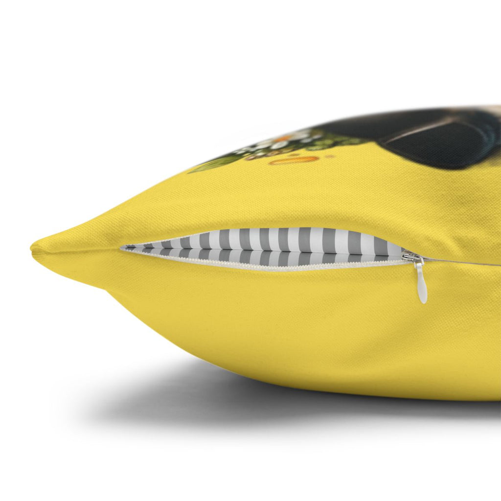 Yellow pillow with a zipper closure and a hint of a printed graphic.