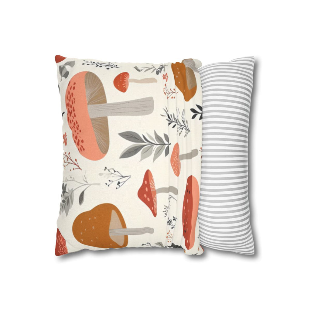 Two pillows with mushroom and leaf pattern on one.
