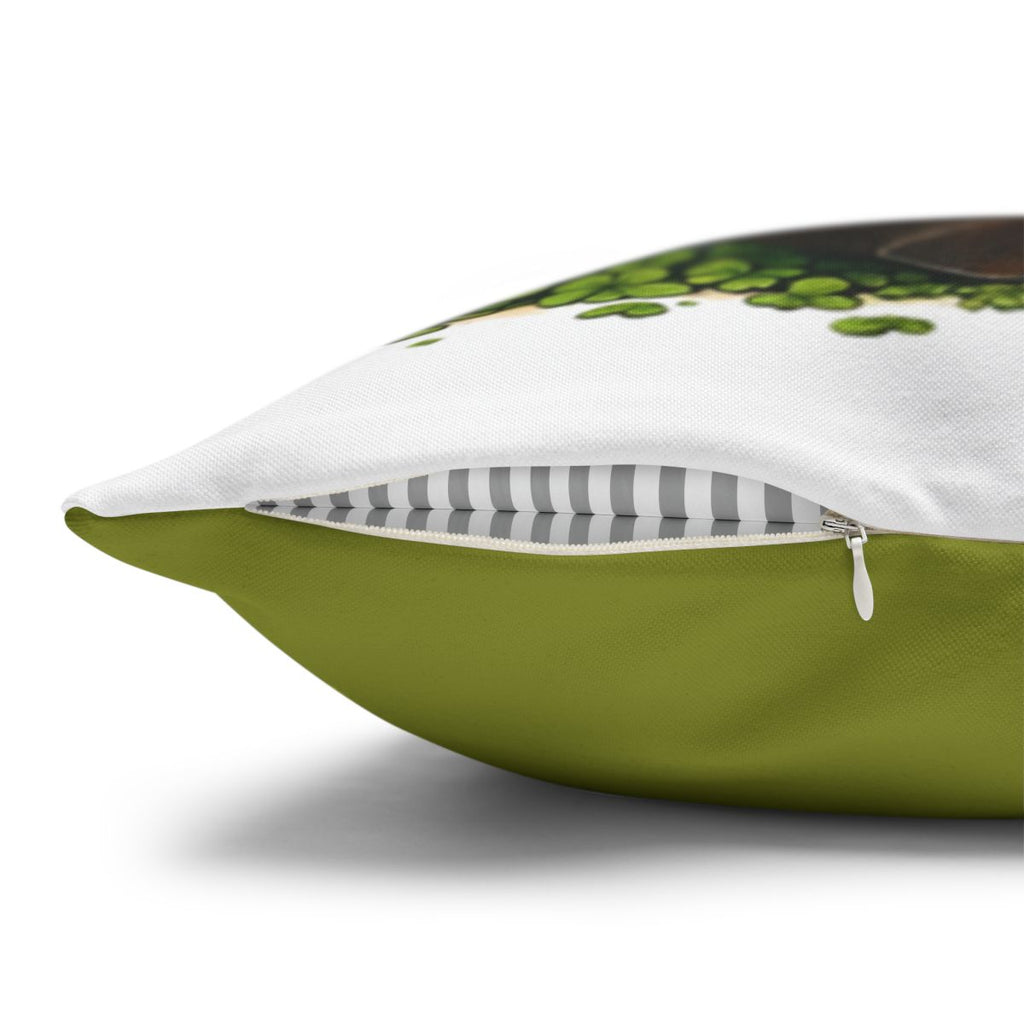 Green pillow with a partial view of a brown object and green leaves.