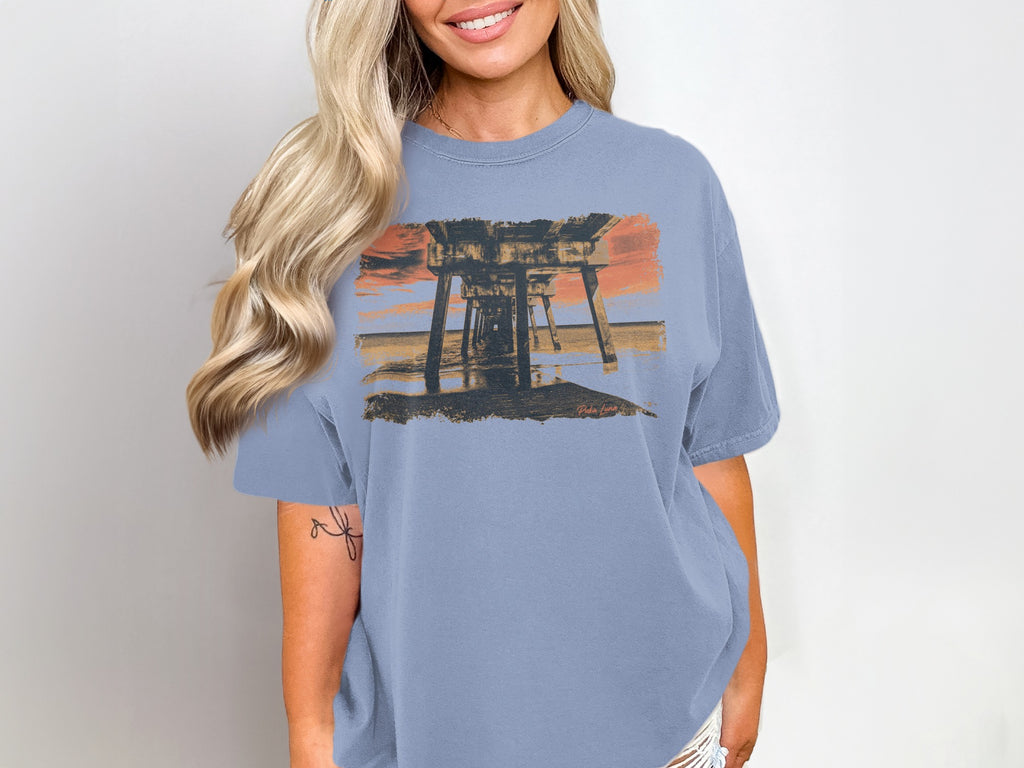 T-shirt with a sunset over a pier graphic.