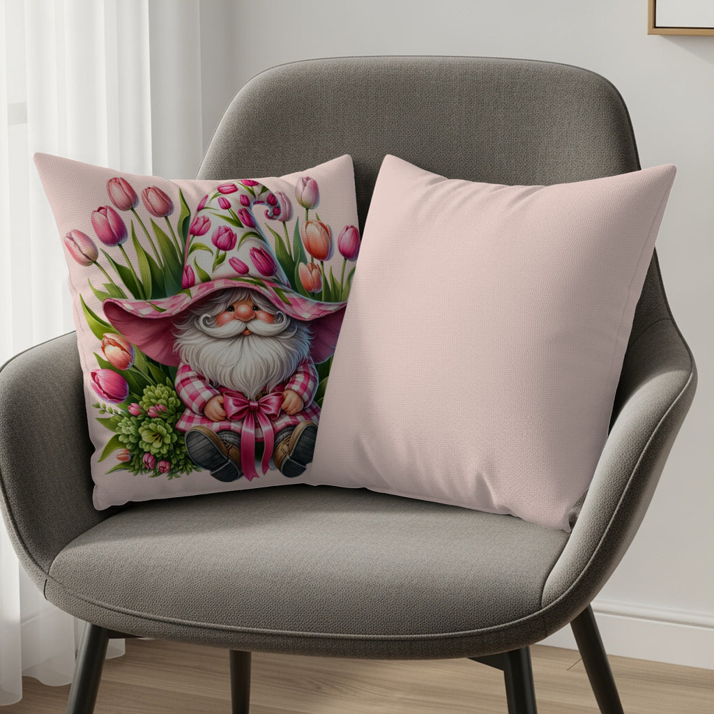 Gnome on pink pillow with tulips and a second plain pink pillow.