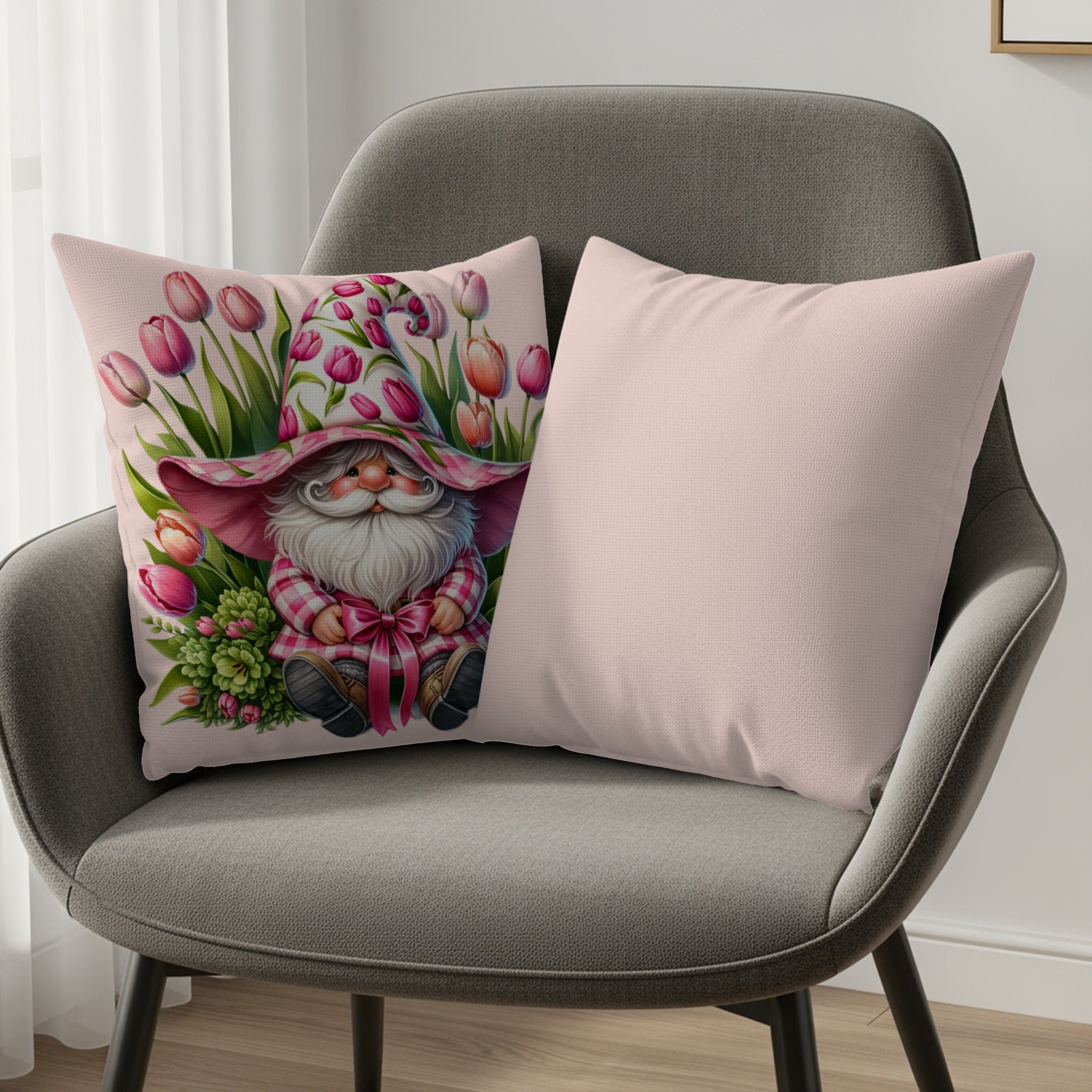 Gnome on pink pillow with tulips and a second plain pink pillow.