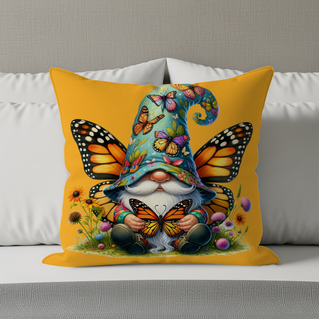 Gnome with butterfly wings and hat sits among flowers holding butterflies.