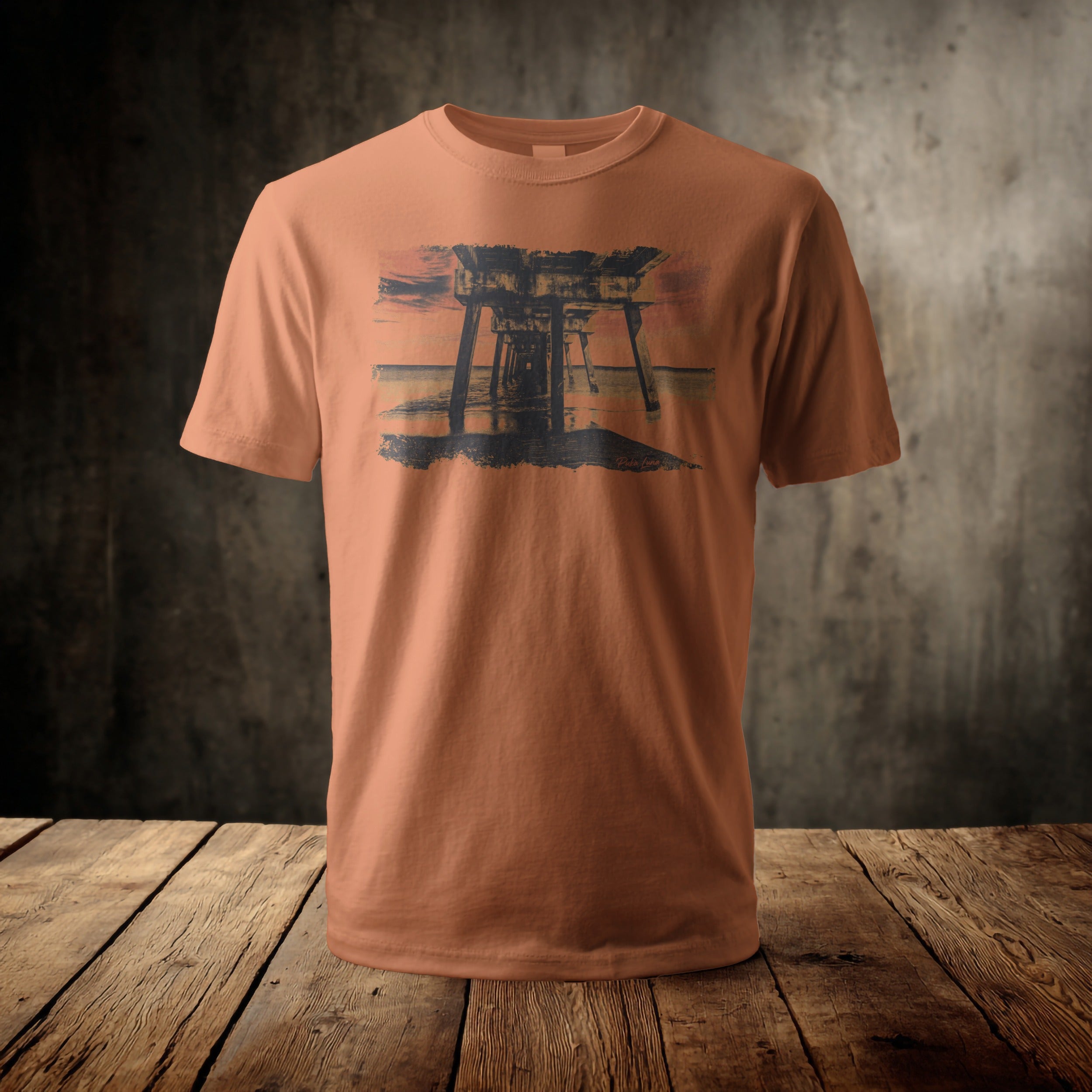 Orange t-shirt with a distressed pier at sunset graphic.