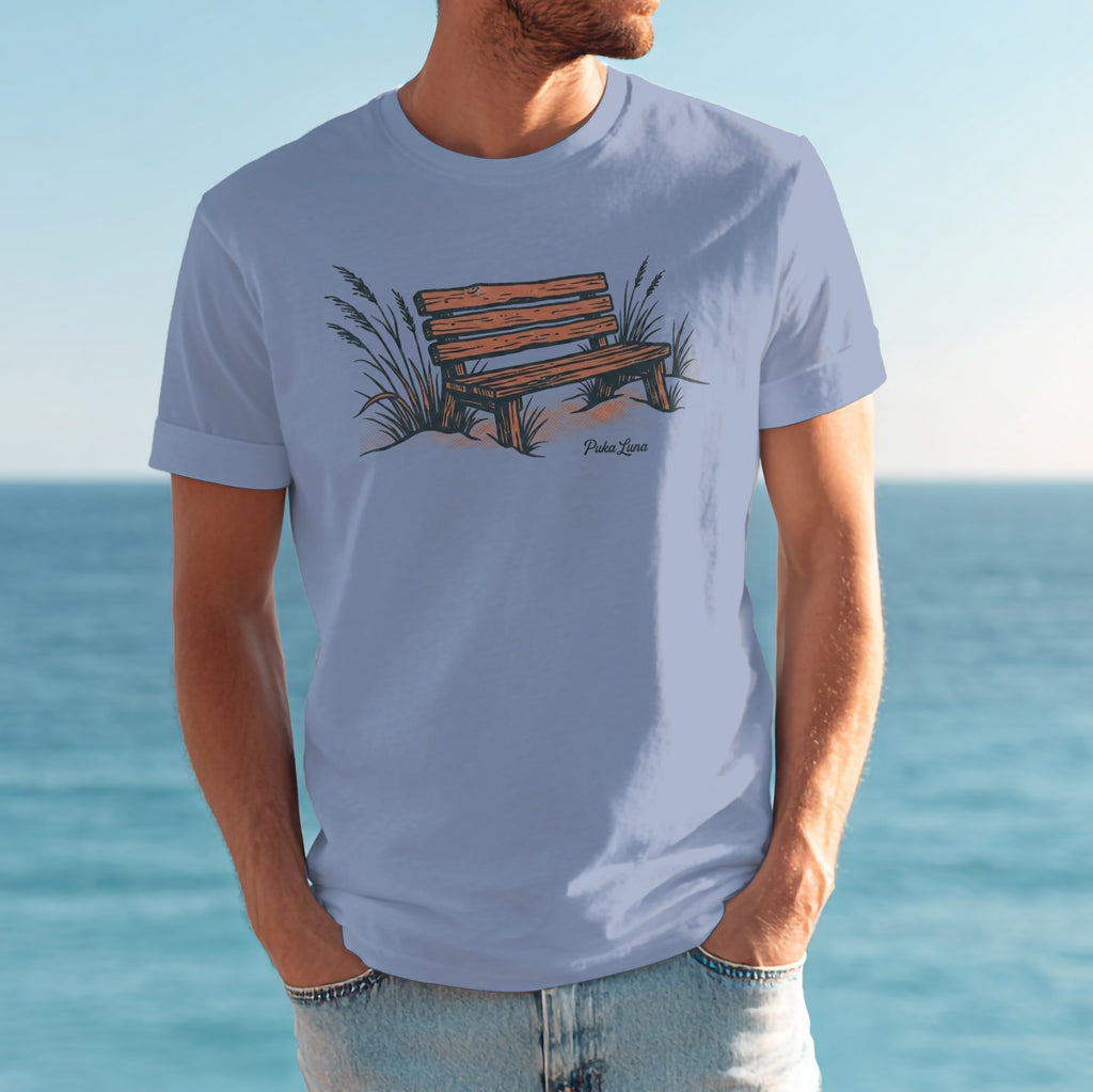 T-shirt with illustration of a wooden bench on a sandy beach.