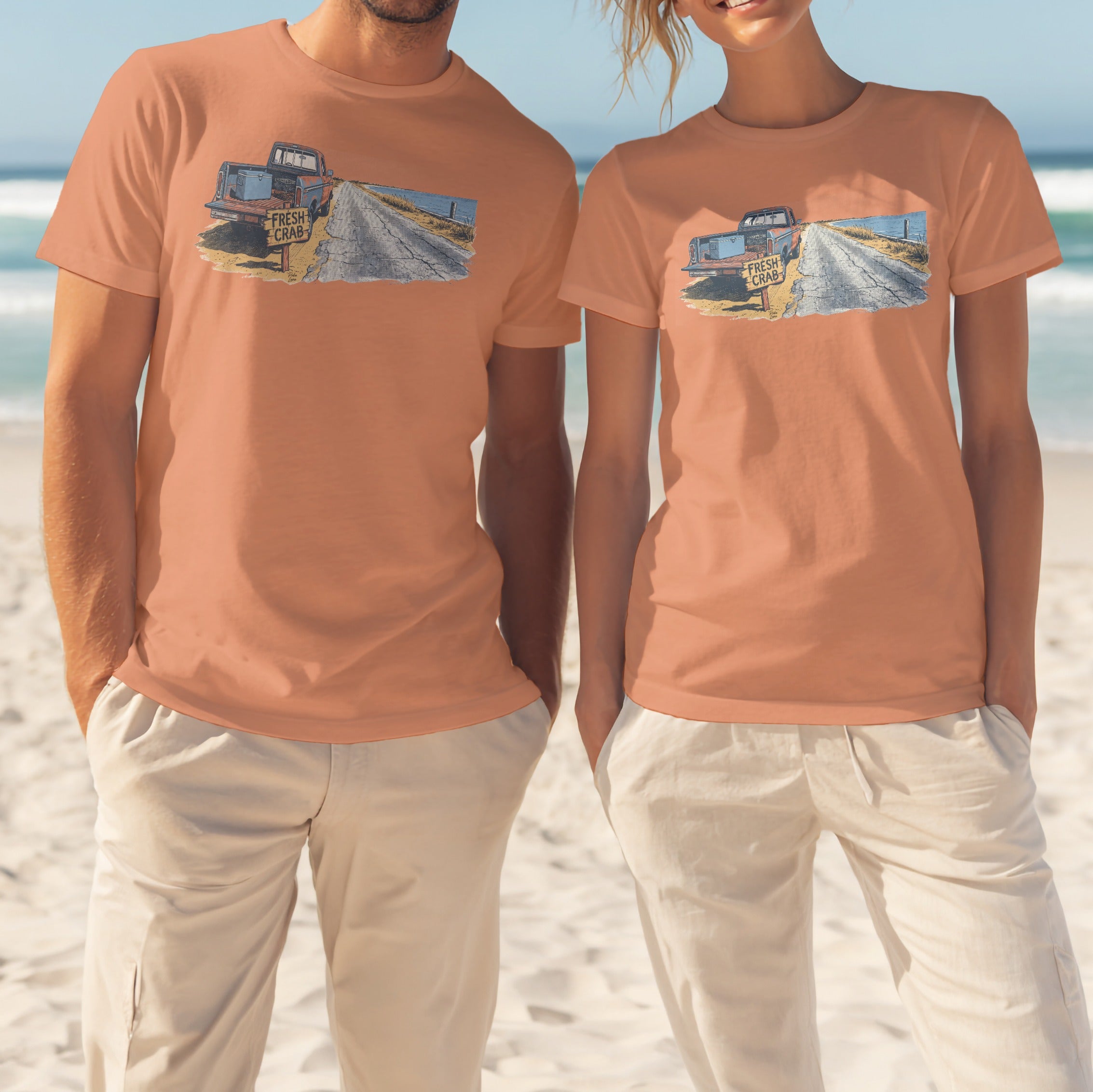 Two people wear peach t-shirts with a truck and "FRESH CRAB" sign graphic.