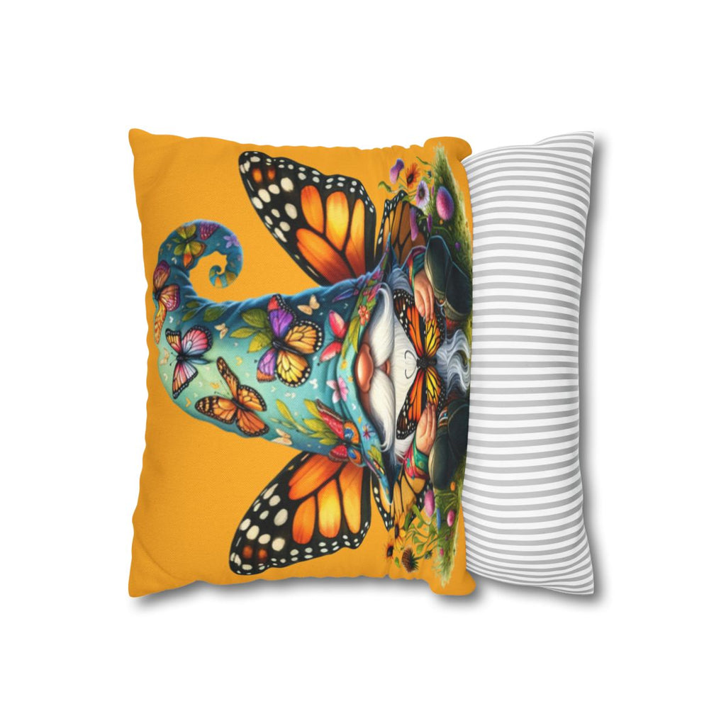 Felt gnome with butterflies and flowers on a yellow pillow.
