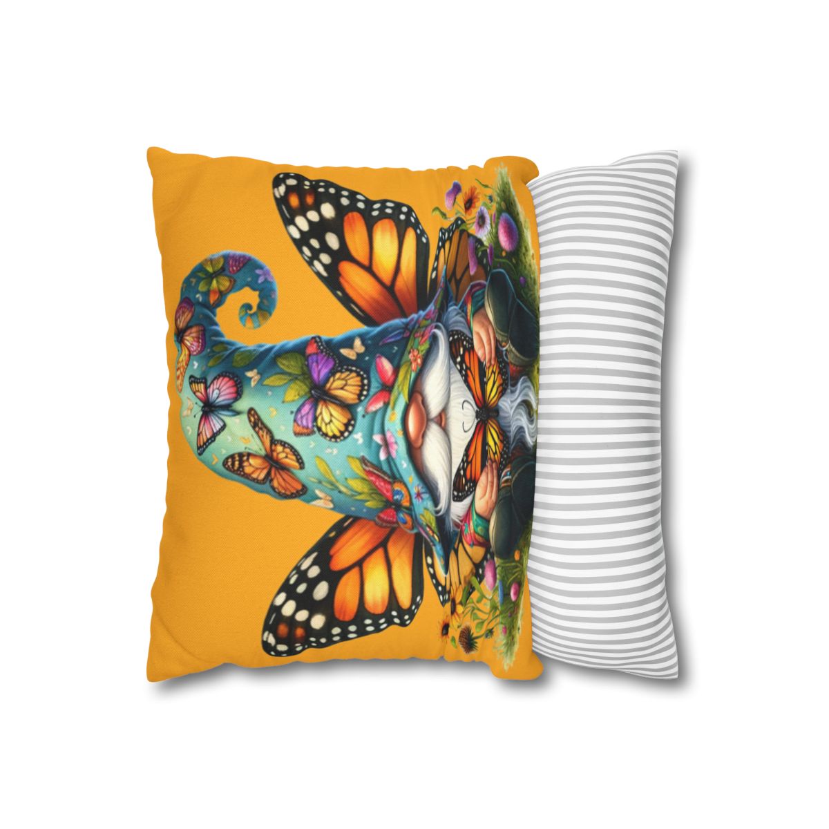 Felt gnome with butterflies and flowers on a yellow pillow.