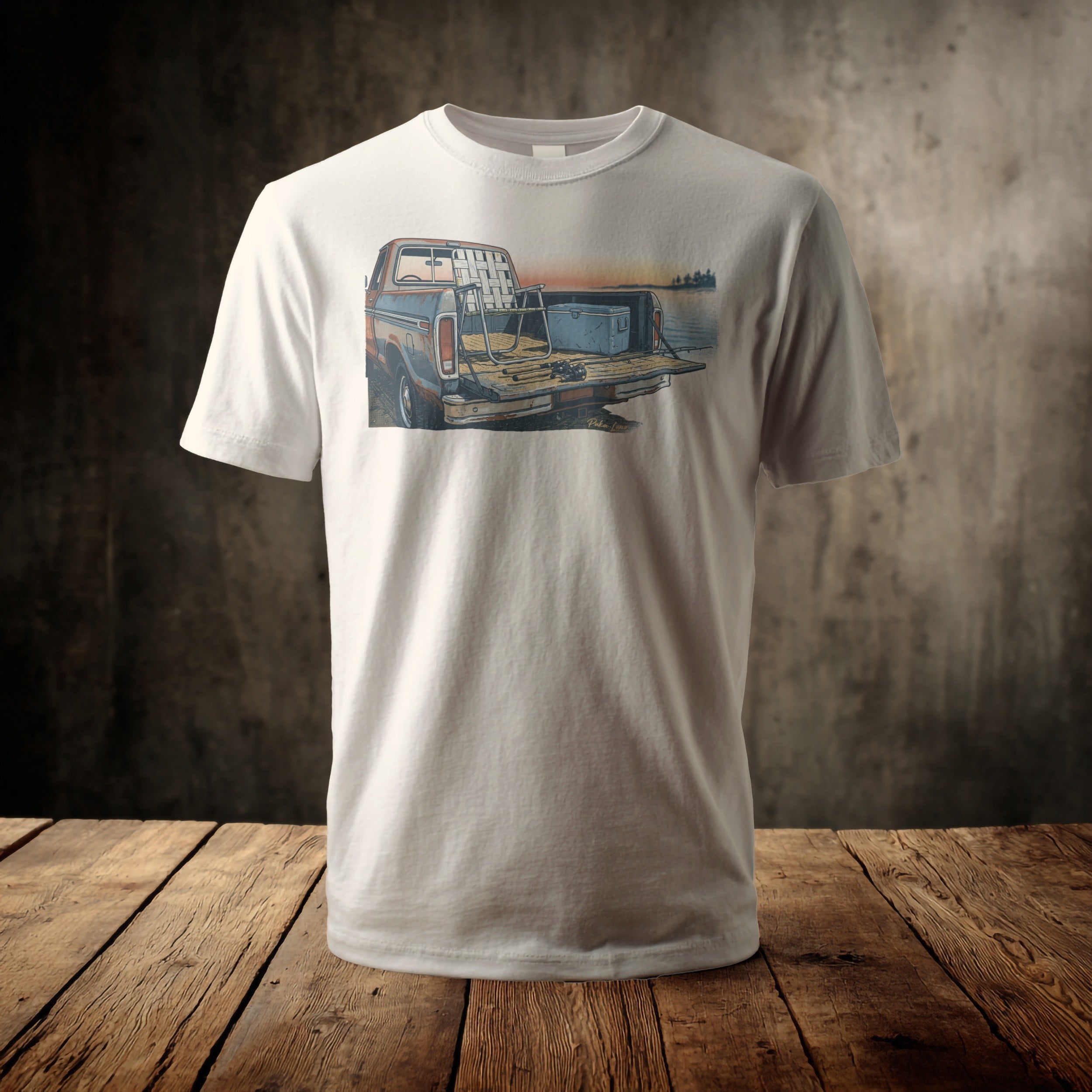 White t-shirt featuring a vintage pickup truck with fishing gear in its bed.