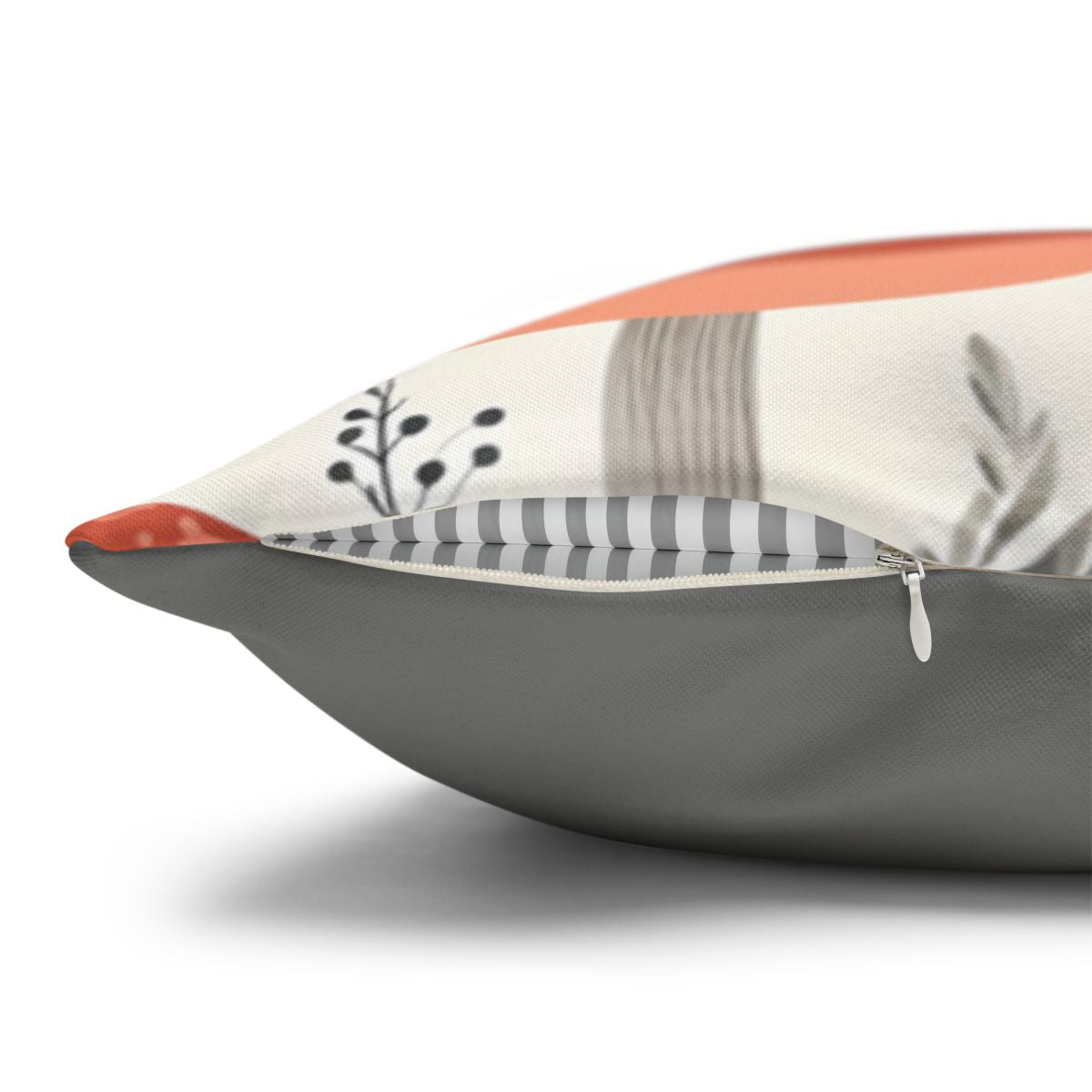 Decorative pillow with abstract floral and striped pattern.