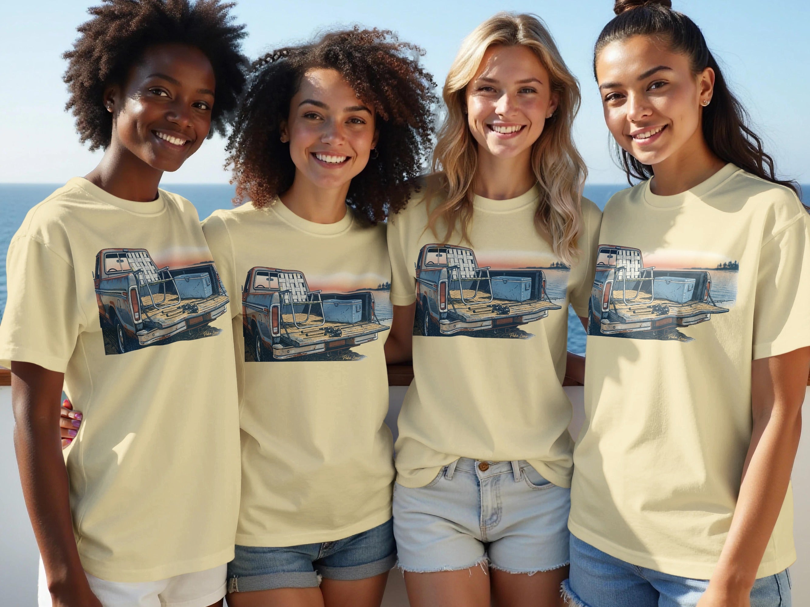 Four women wear t-shirts featuring a vintage truck loaded with fishing gear.