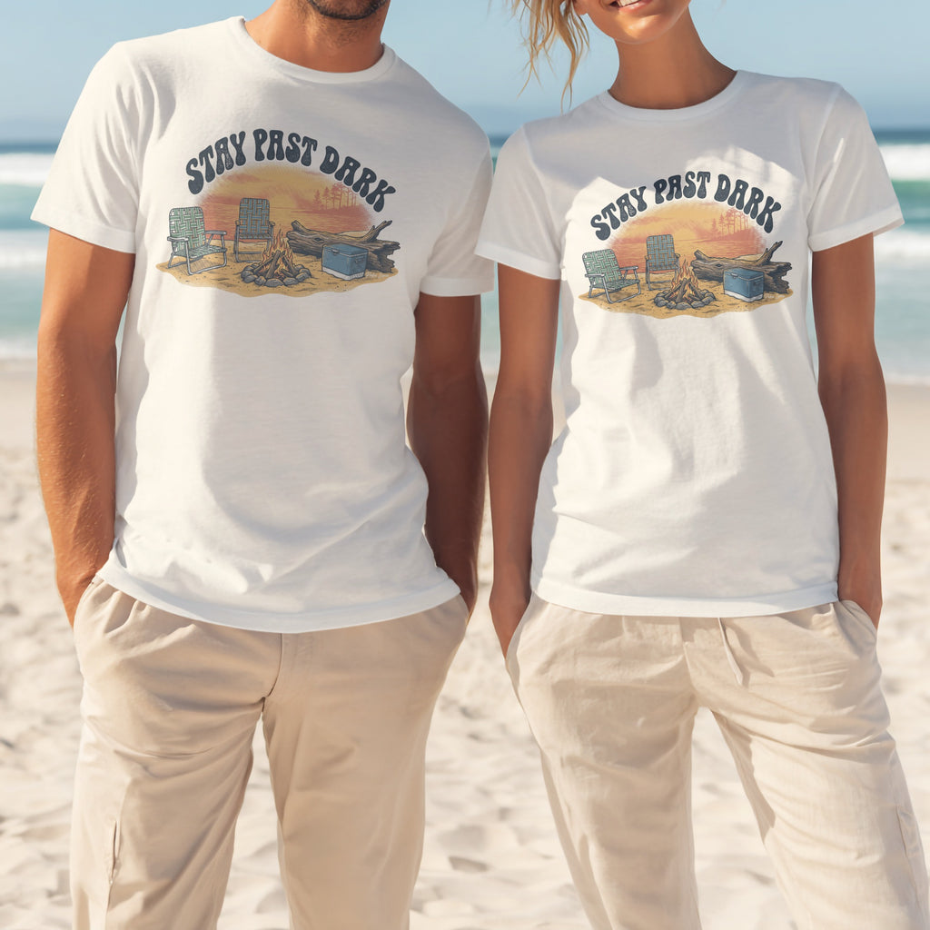 Two white t-shirts with "Stay Past Dark" campfire graphic.