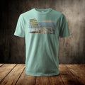 Pale green t-shirt with a printed image of a weathered chair on a pier.