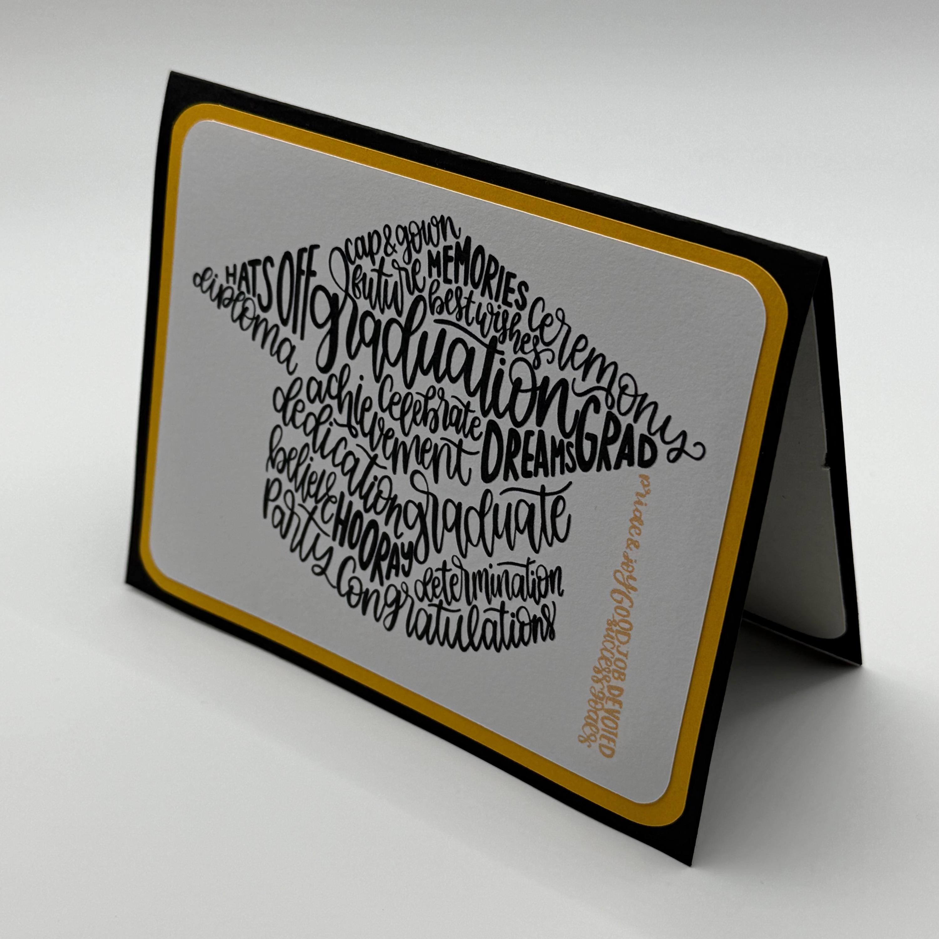 Graduation Card – Mortarboard Word Art in Black & Gold
