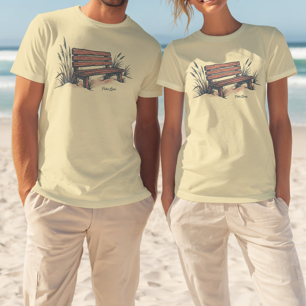 Light yellow t-shirts with a wooden bench and grass illustration.