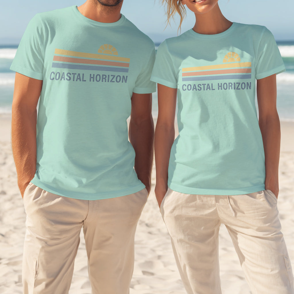 Two people wearing matching light blue t-shirts with "COASTAL HORIZON" and a striped sunset logo.