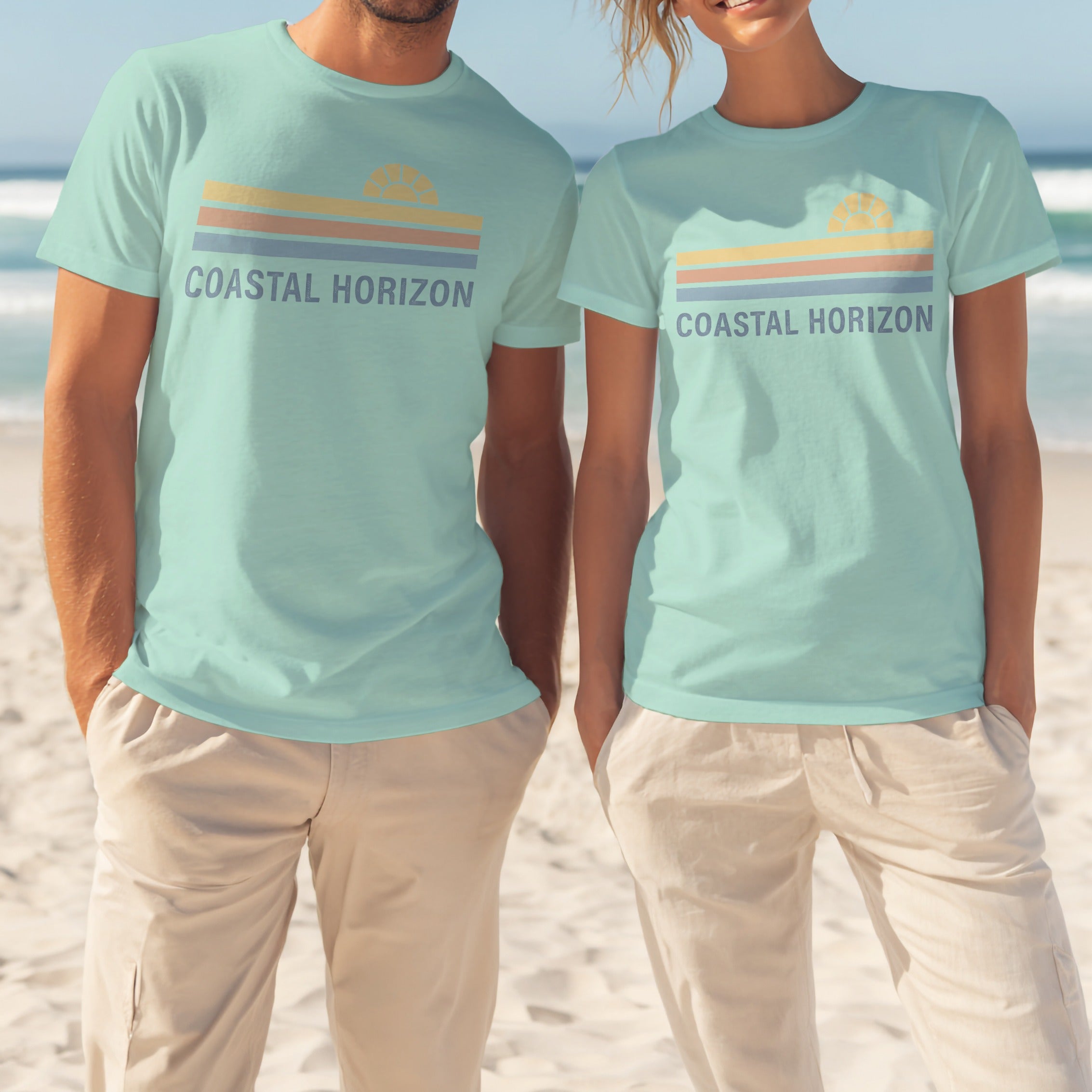 Two people wearing matching light blue t-shirts with "COASTAL HORIZON" and a striped sunset logo.