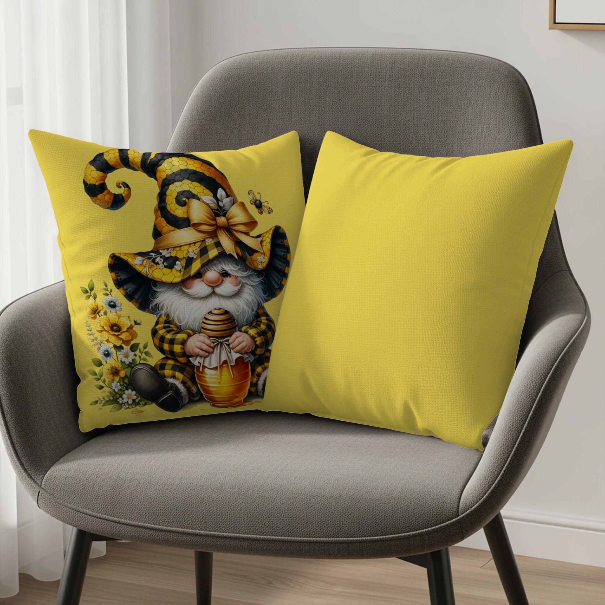 Gnome with honeycomb on yellow pillow next to plain yellow pillow on gray chair.