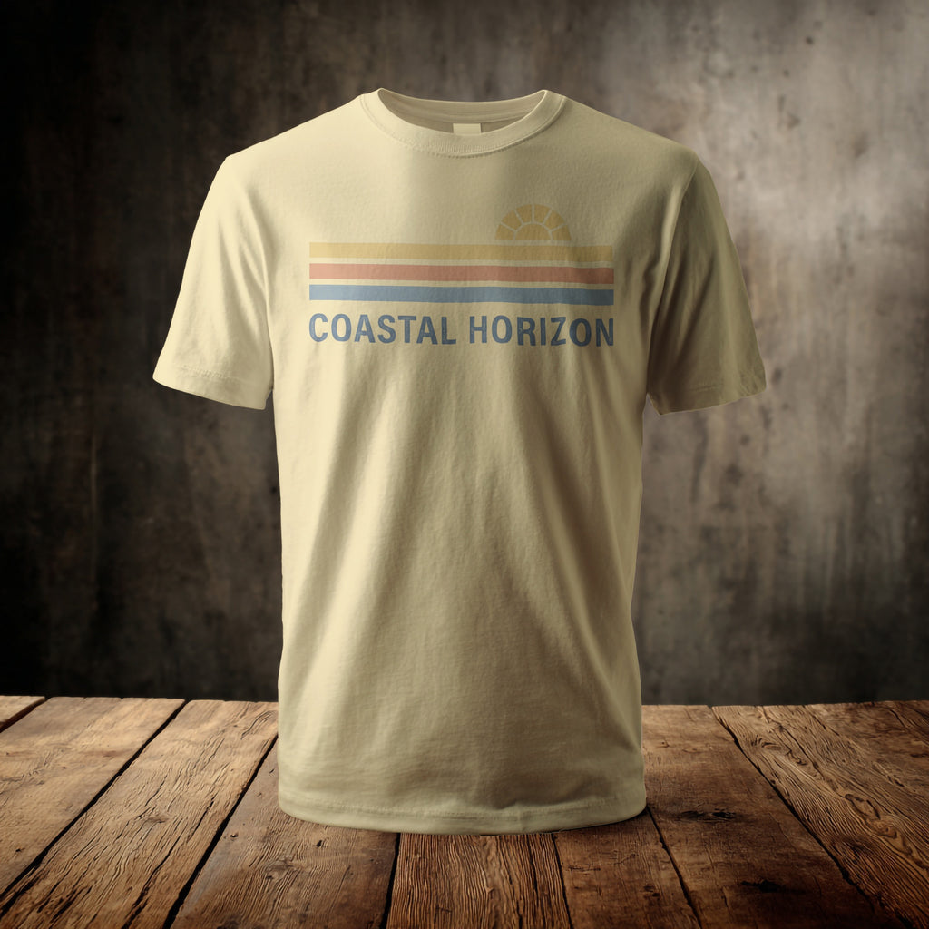 Light tan t-shirt with "Coastal Horizon" text and a sun graphic.