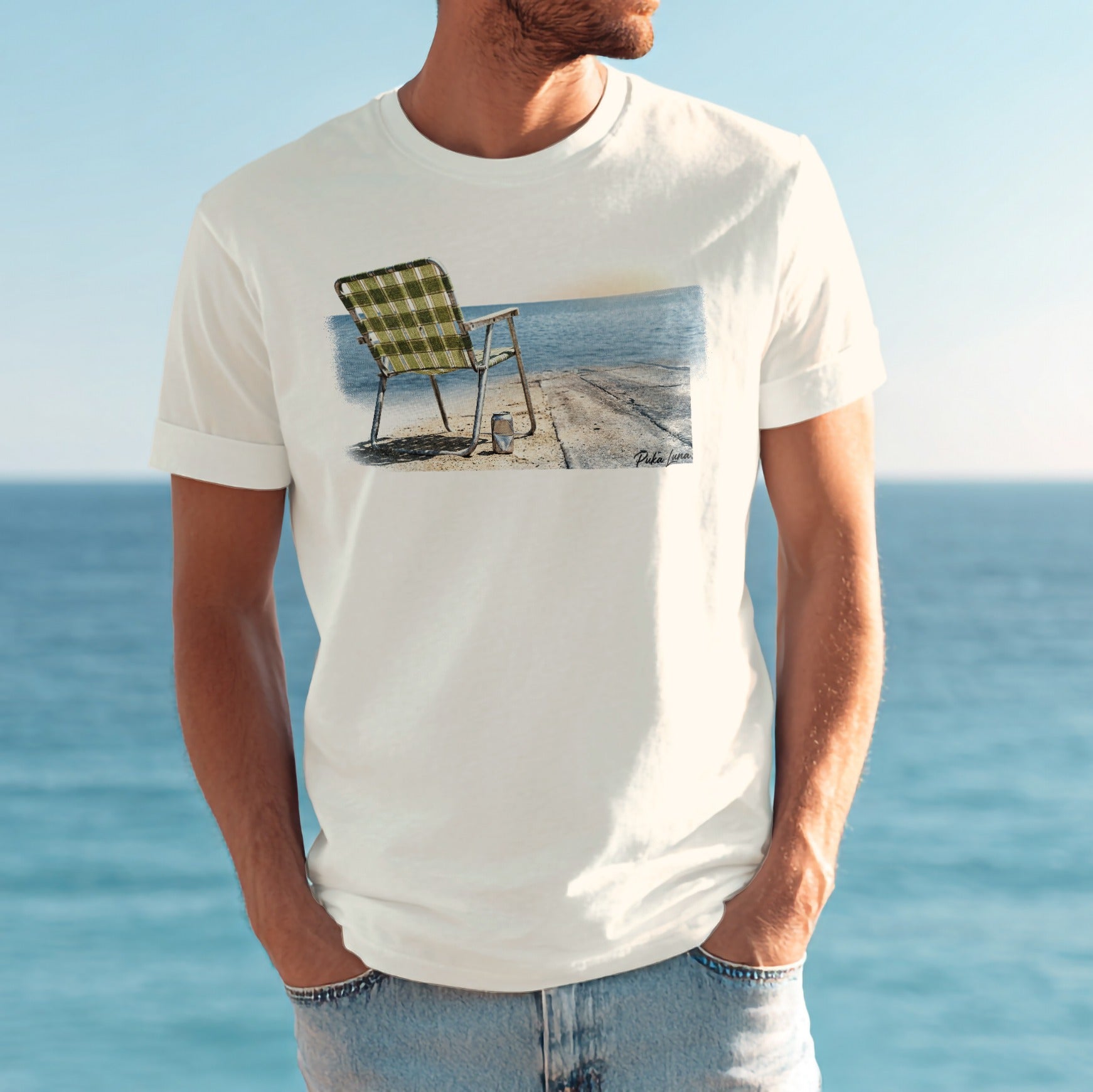 T-shirt with a beach chair and ocean scene printed on it.