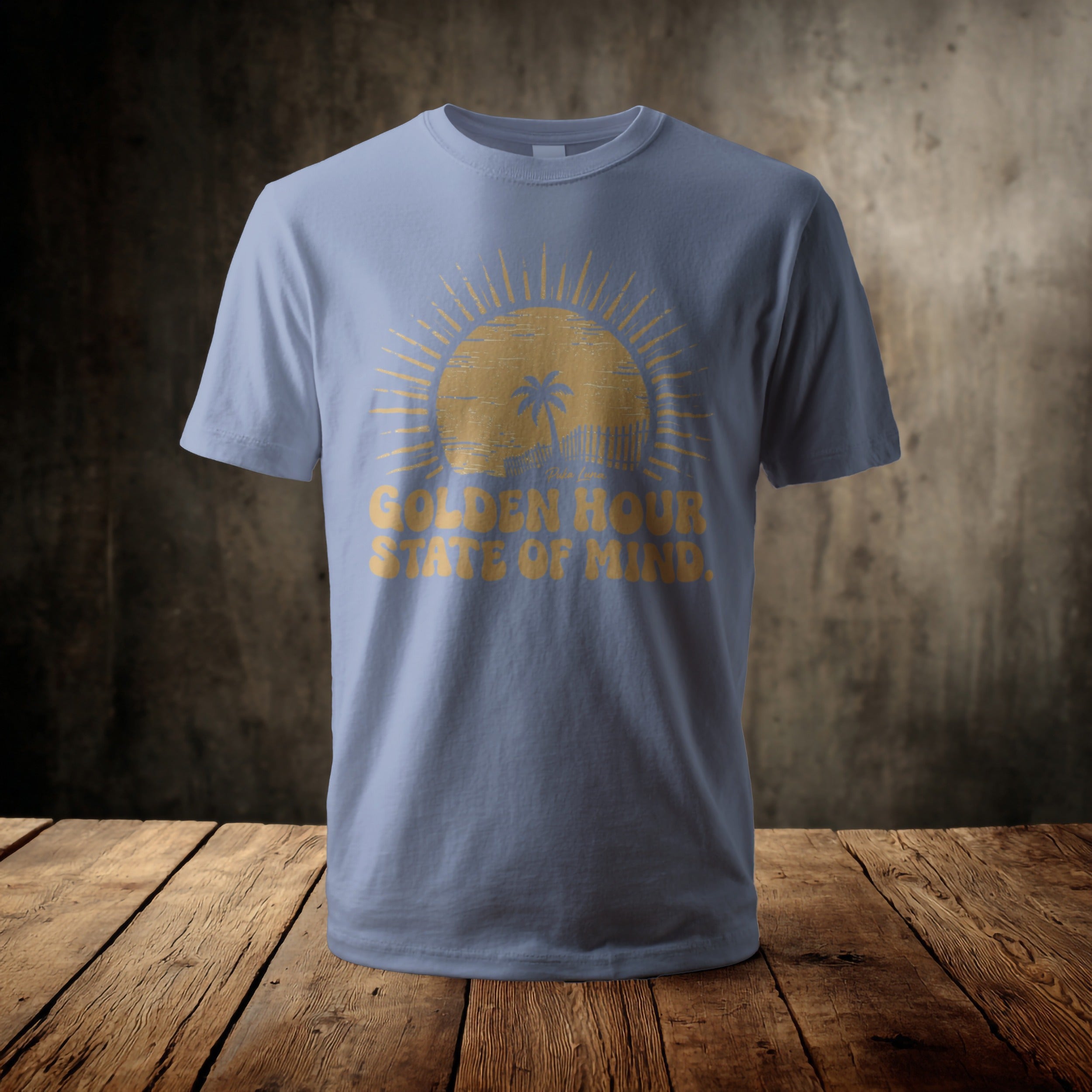 Light blue t-shirt with a golden sun and "Golden Hour State of Mind" text.