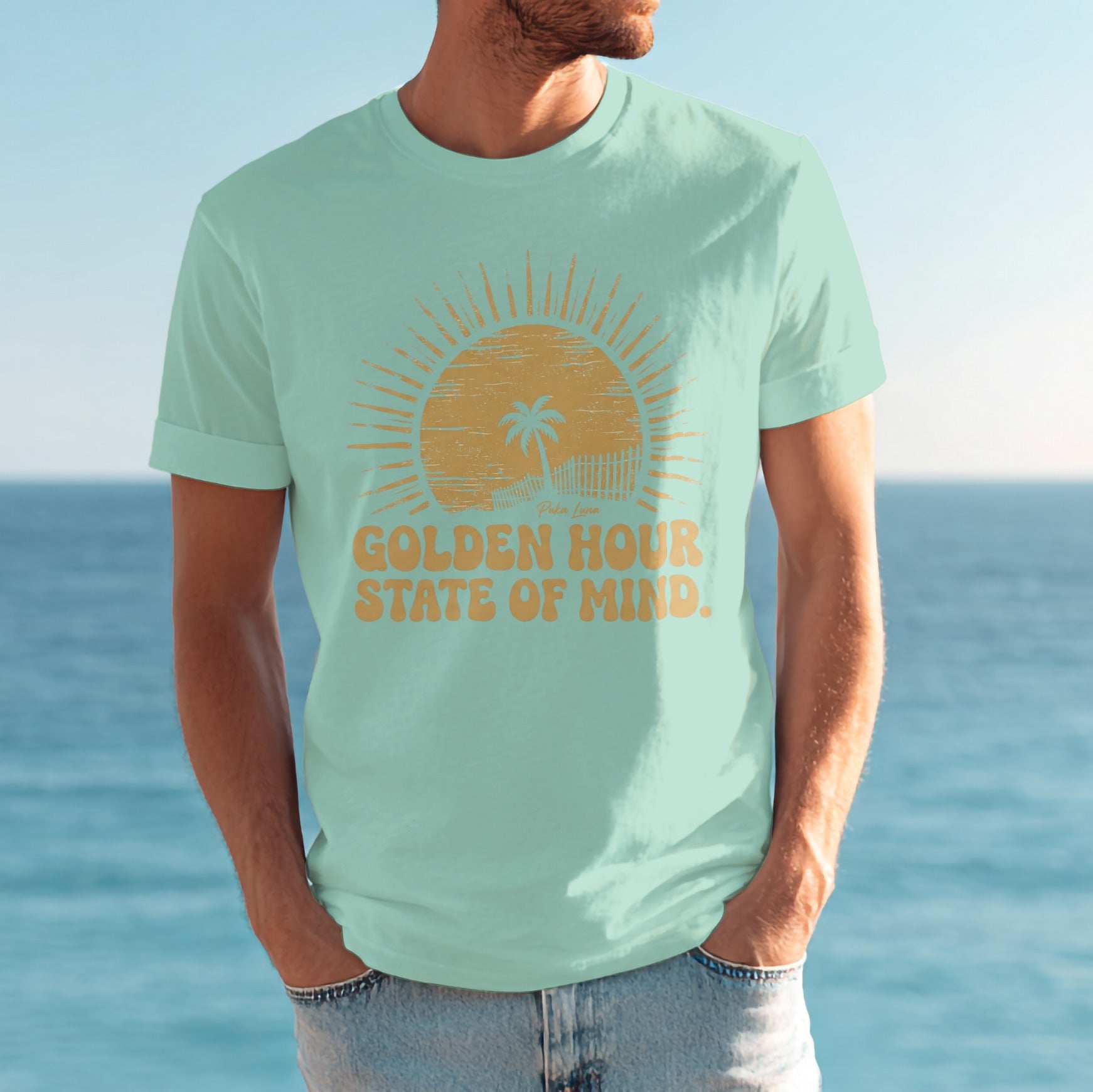 Light mint t-shirt with "Golden Hour State of Mind" and sun graphic.