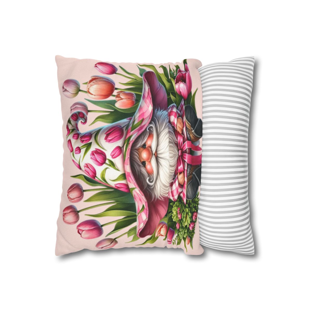 Gnome with tulips on pillow next to striped pillow.